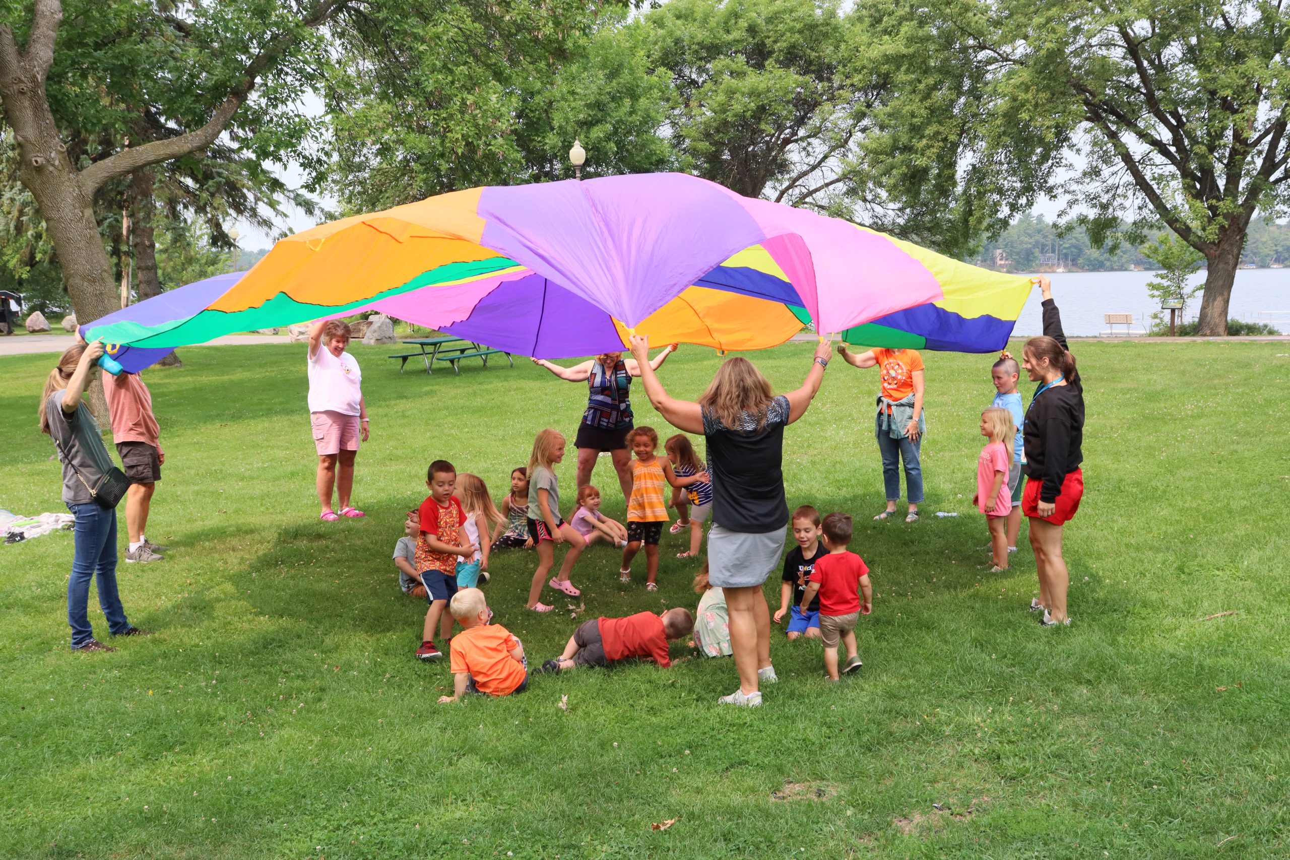 Adults and kids with parachute