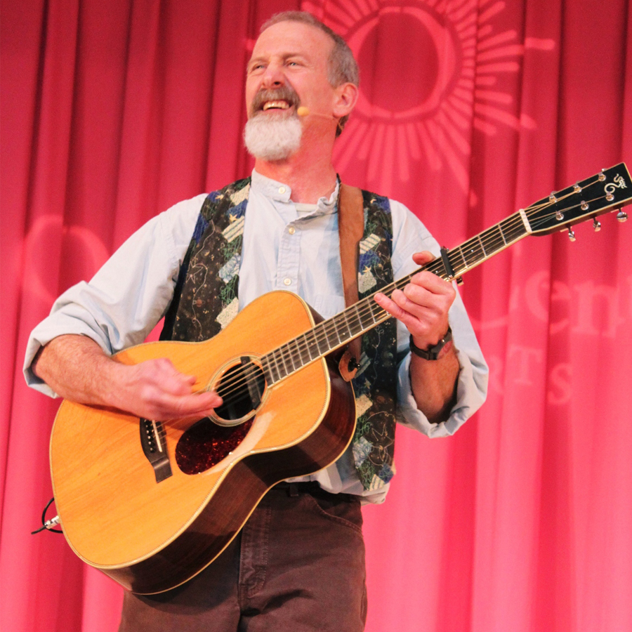 Tom Pease Playing guitar