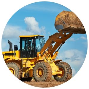 Picture of a bulldozer under a blue sky with clouds
